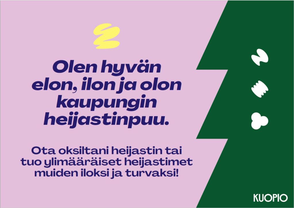 Heijastinpuussa olevan kyltin kuva, jossa lukee Olen hyvän, elon, ilon ja olon kaupungin heijastinpuu. Ota oksiltani heijastin tai tuo ylimääräiset heijastimet muiden iloksi ja turvaksi.